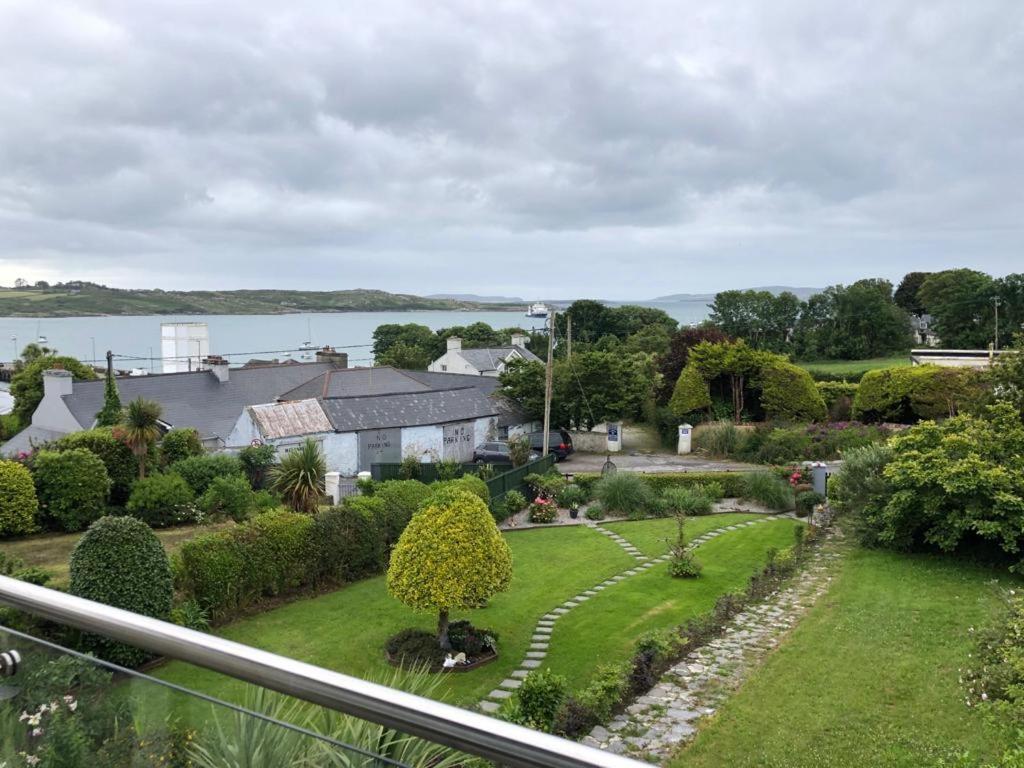 a view of a garden from the balcony of a house at Beautiful Holiday Home in Schull in Schull