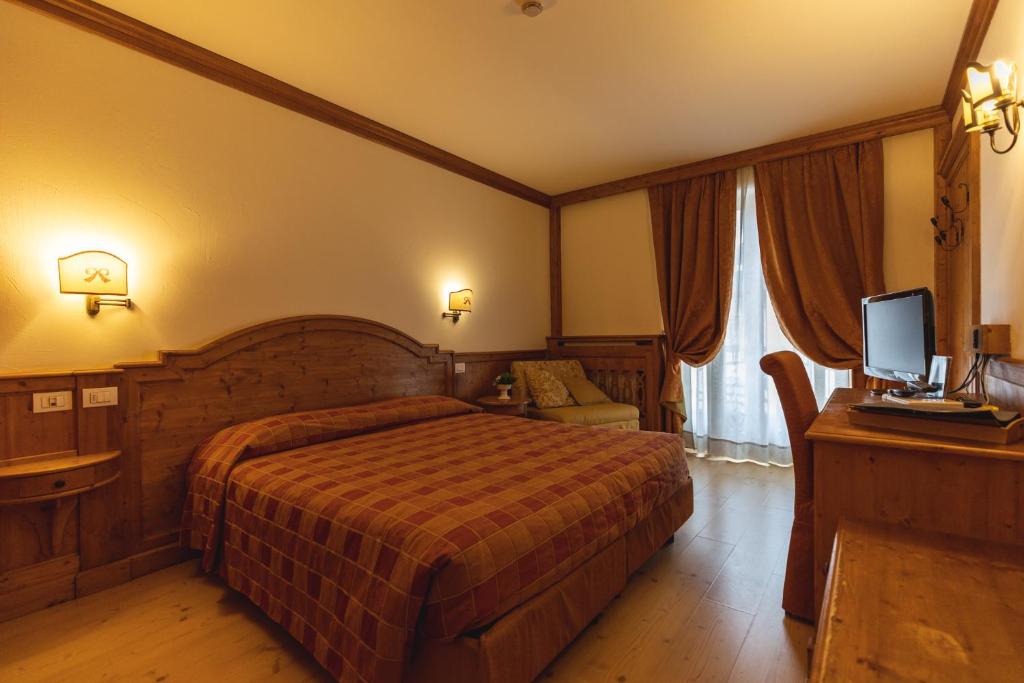 Postel nebo postele na pokoji v ubytování Hotel Europa Residence