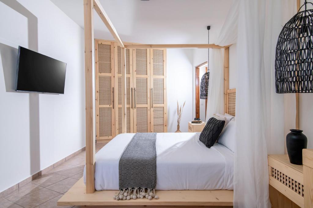 Posteľ alebo postele v izbe v ubytovaní Elèa Concept Hotel & Suites