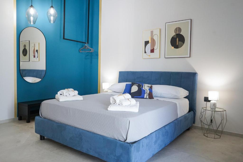 Postel nebo postele na pokoji v ubytování Thalassa Rooms