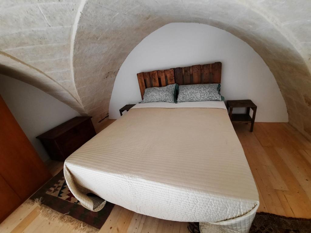 Postel nebo postele na pokoji v ubytování B&b la vecchia corte