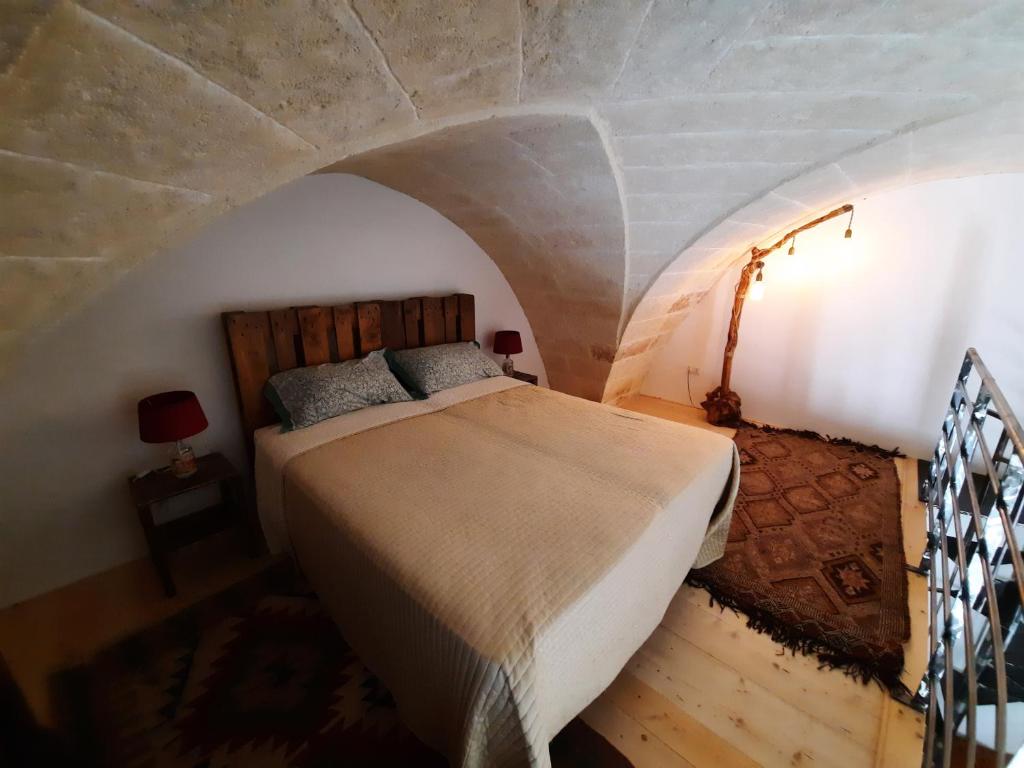 Postel nebo postele na pokoji v ubytování B&b la vecchia corte