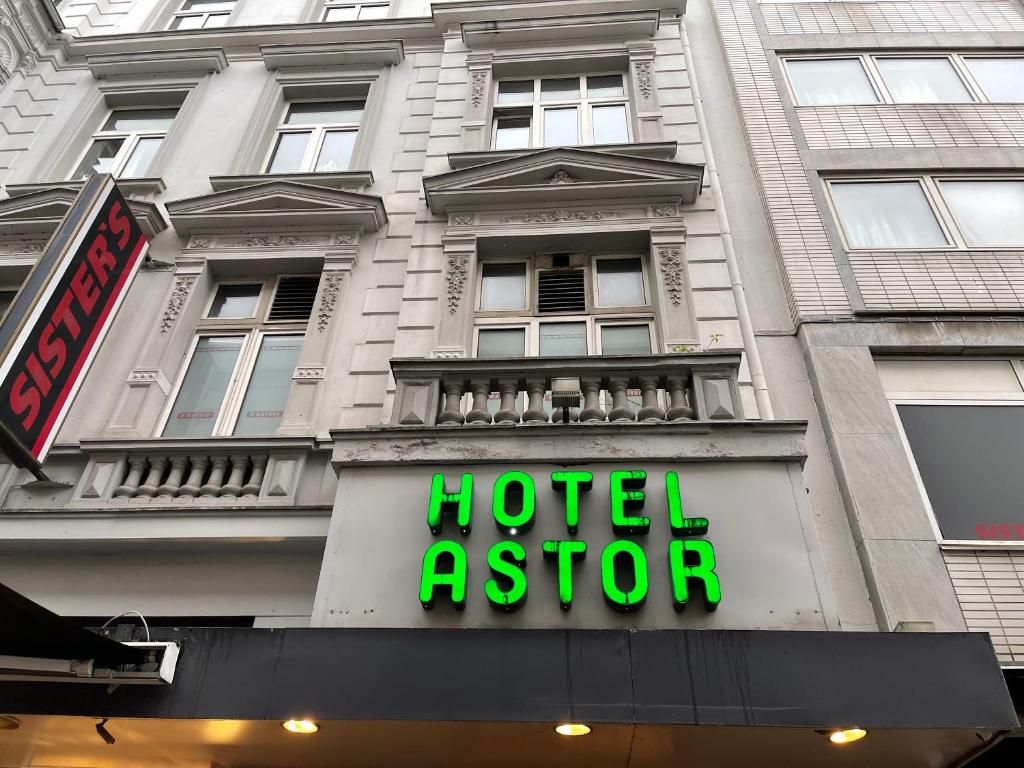 a hotel agent sign in front of a building at Hotel Astor in Wuppertal