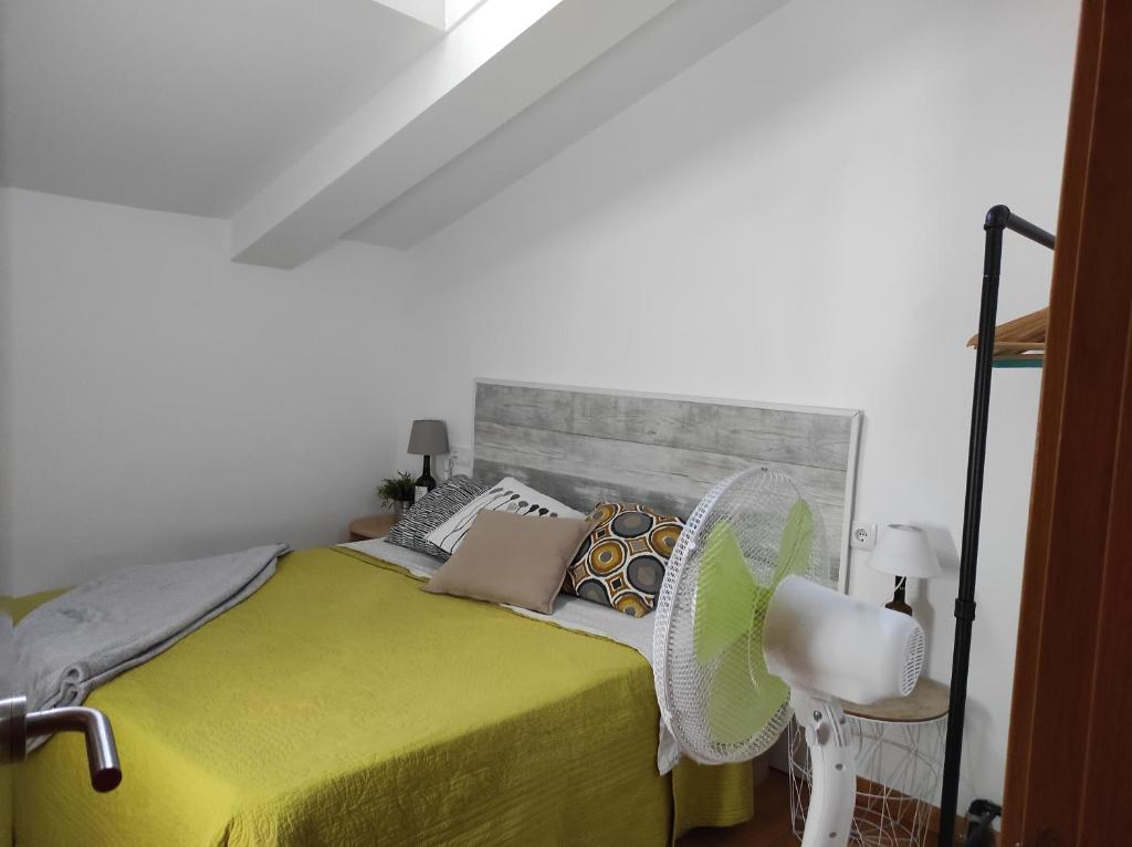 A bed or beds in a room at El Tesoro de Baco