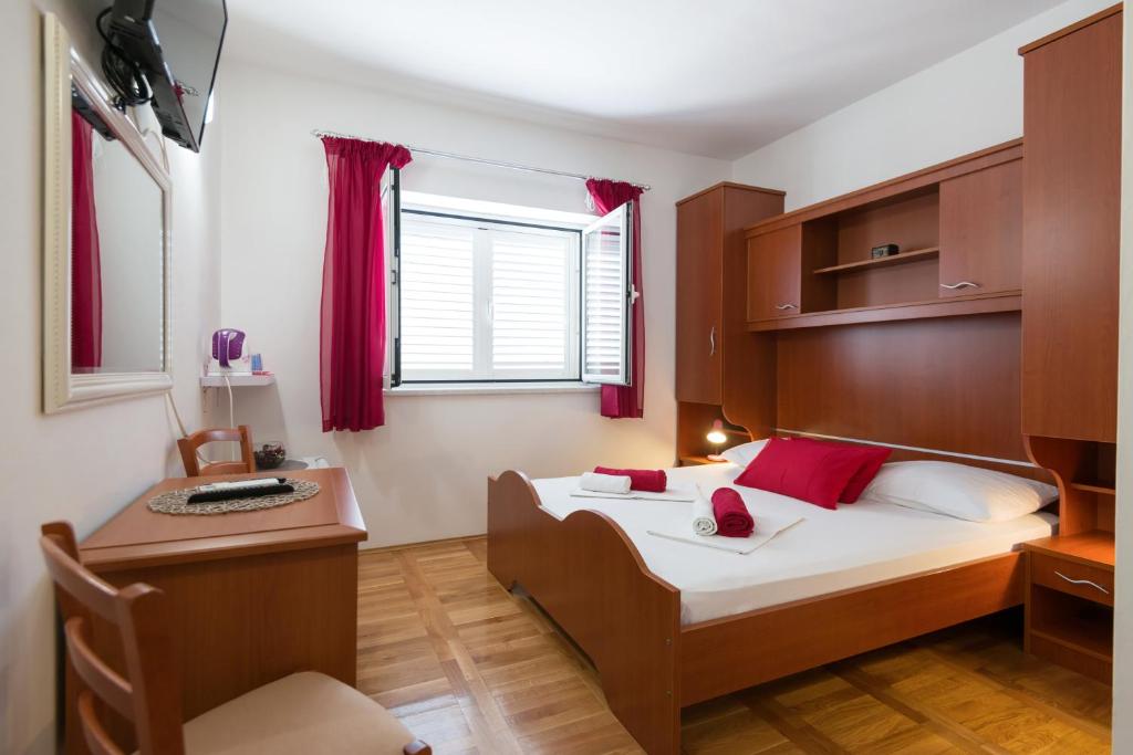 Postel nebo postele na pokoji v ubytování Guesthouse Sanela