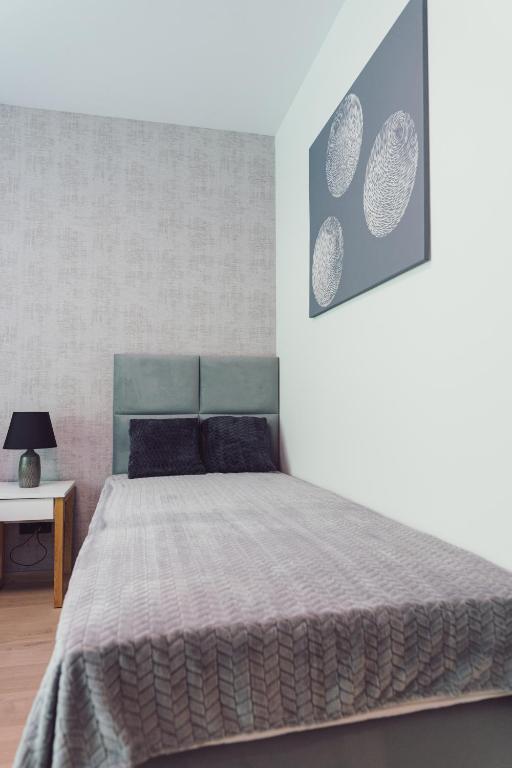 Posteľ alebo postele v izbe v ubytovaní Nice River - MAZURIA APARTAMENTY