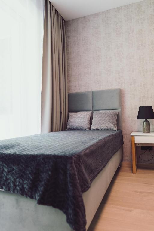 Posteľ alebo postele v izbe v ubytovaní Nice River - MAZURIA APARTAMENTY