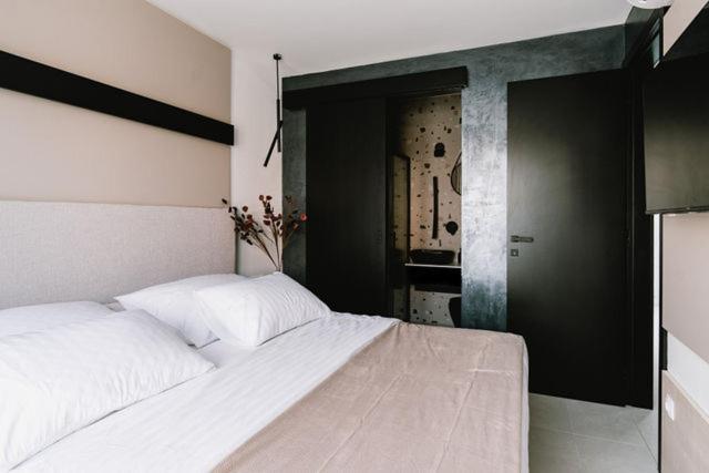 Postel nebo postele na pokoji v ubytování Villa Casa Domina