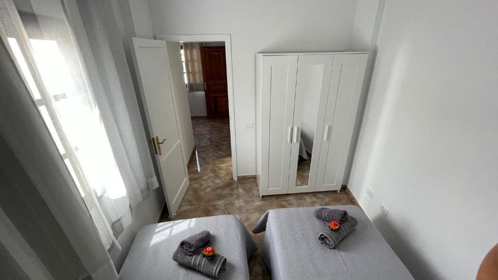 Posteľ alebo postele v izbe v ubytovaní Vivienda Vacacional Tienda Loly