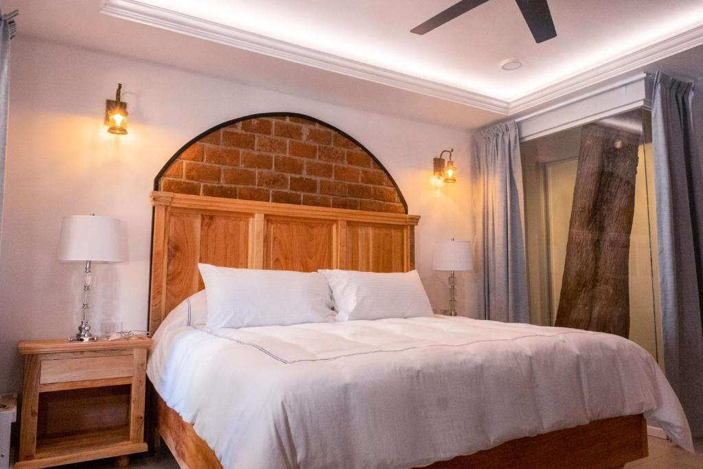 Postel nebo postele na pokoji v ubytování Hacienda Valentino