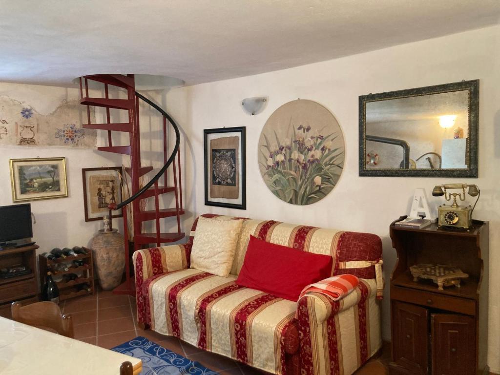a living room with a couch and a ladder at B&B Ameglia in Garessio