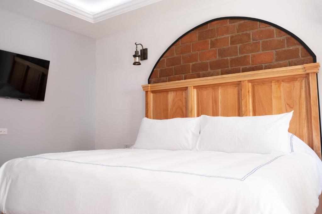 Postel nebo postele na pokoji v ubytování Hacienda Valentino