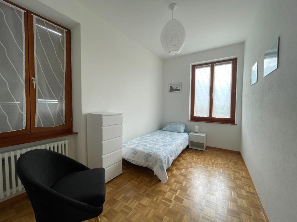 Postel nebo postele na pokoji v ubytování Residence Gaggiole, apartment 3