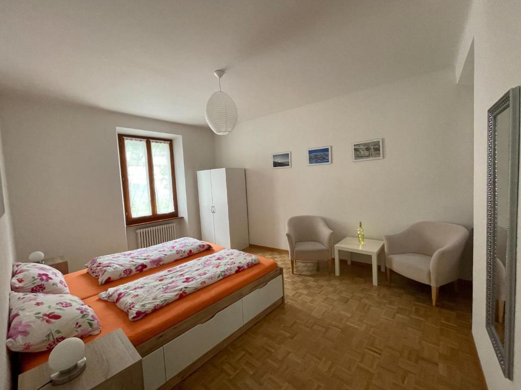 Postel nebo postele na pokoji v ubytování Residence Gaggiole, apartment 3