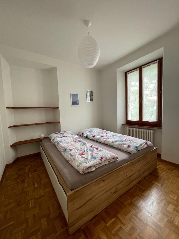 Postel nebo postele na pokoji v ubytování Residence Gaggiole, apartment 3