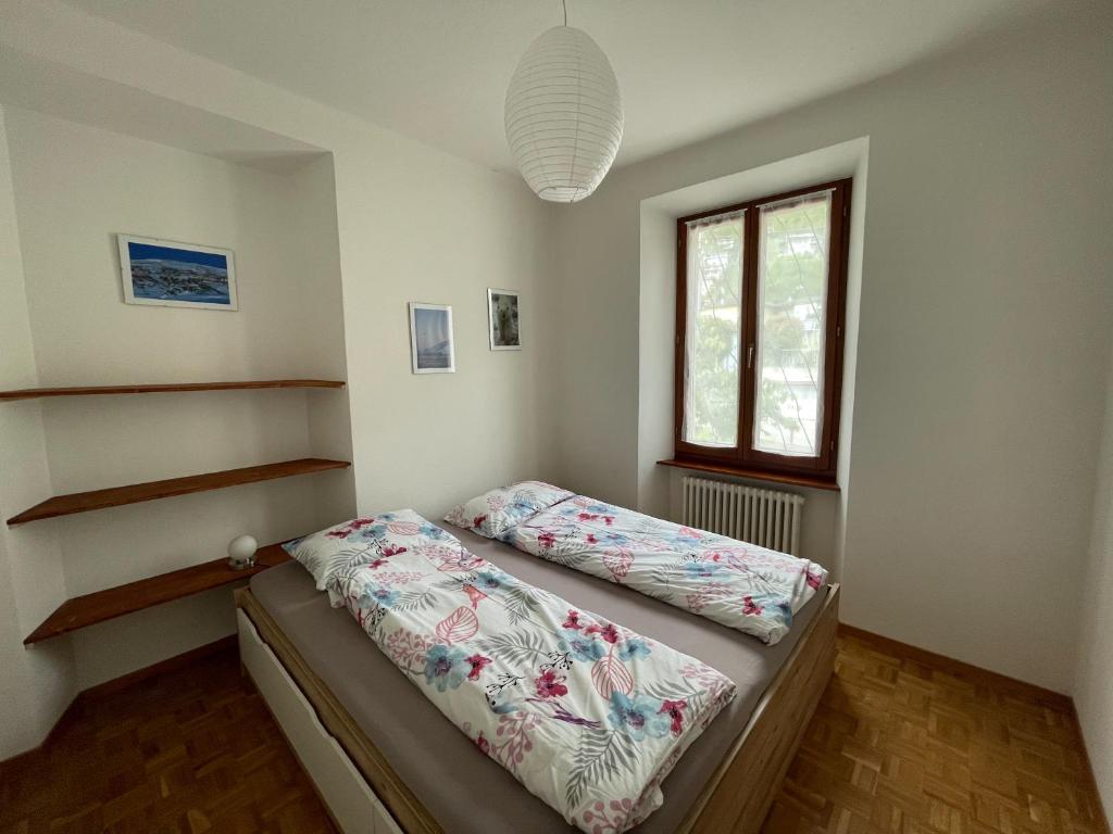 Postel nebo postele na pokoji v ubytování Residence Gaggiole, apartment 3