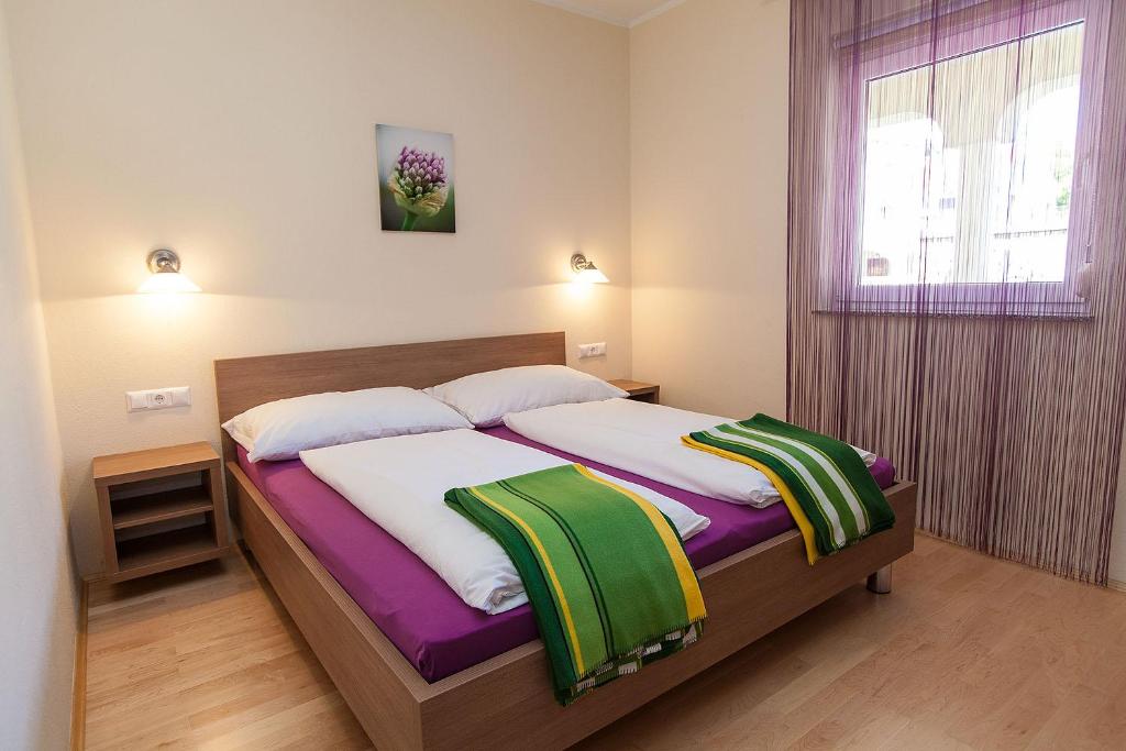 Postel nebo postele na pokoji v ubytování Villa Lilli - Appartements Kroatien