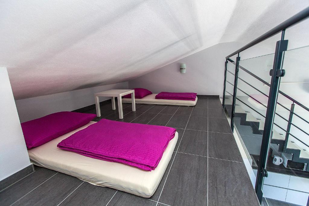 Postel nebo postele na pokoji v ubytování Villa Lilli - Appartements Kroatien