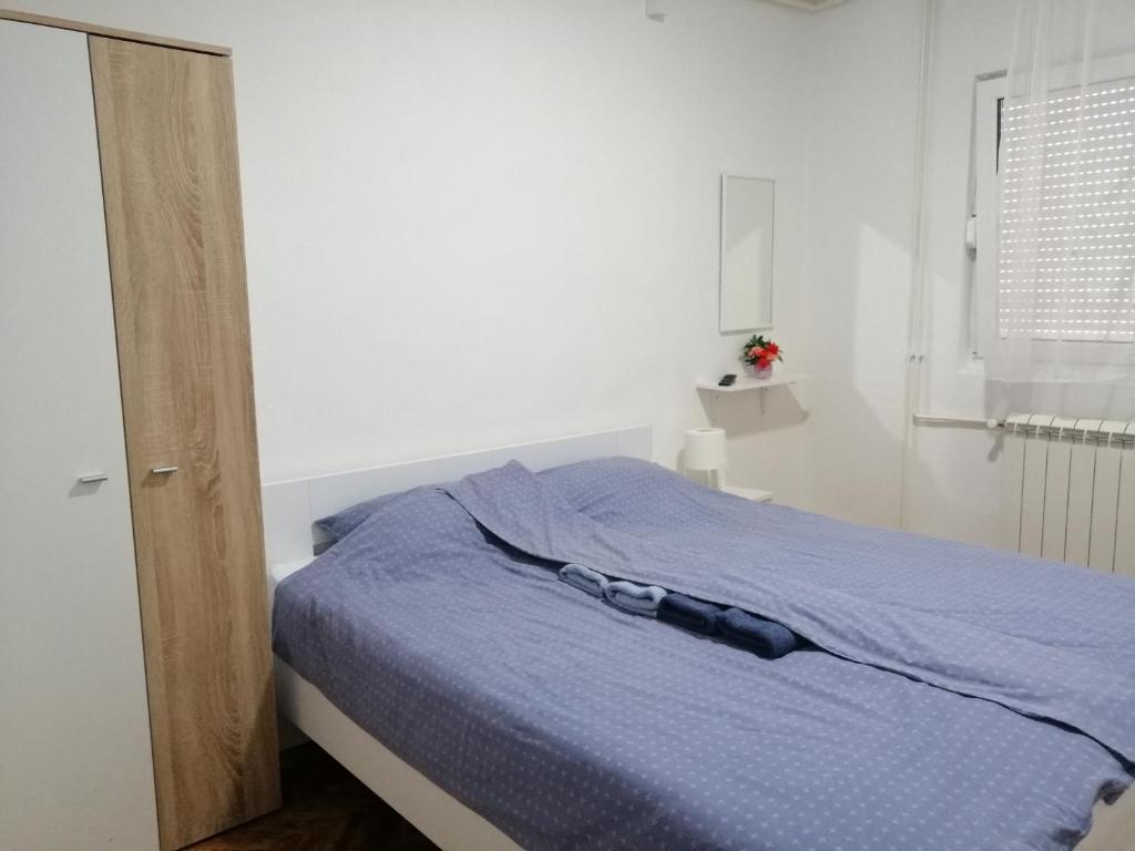 Postel nebo postele na pokoji v ubytování Apartman Nana Jagodina