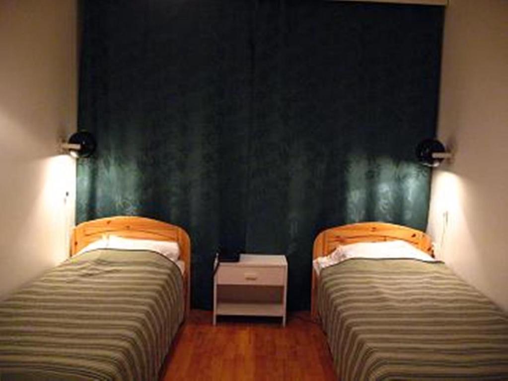Postel nebo postele na pokoji v ubytování Nepi Hotell