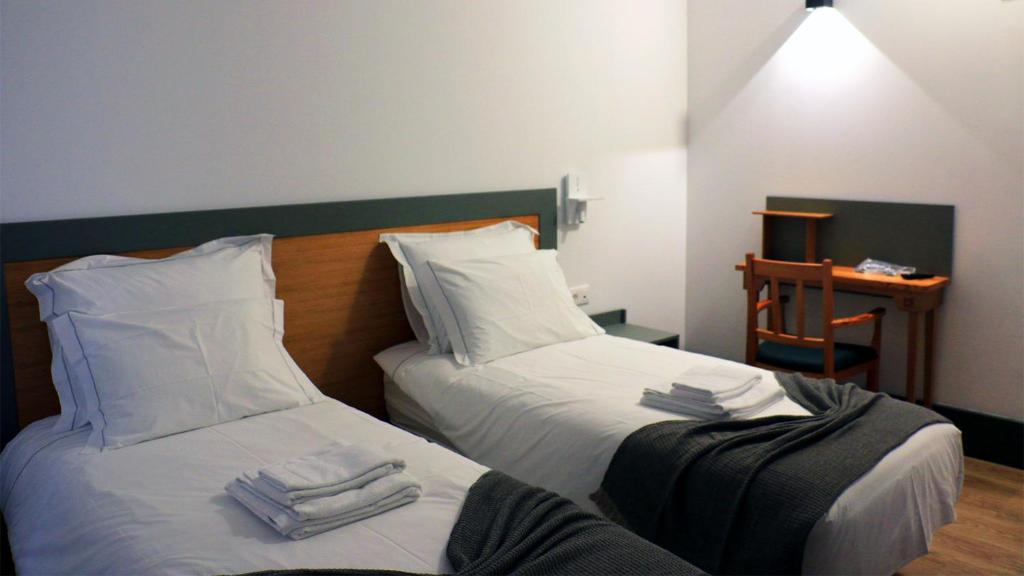 Postel nebo postele na pokoji v ubytování Aliança café & hostel