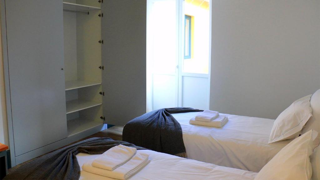 Postel nebo postele na pokoji v ubytování Aliança café & hostel