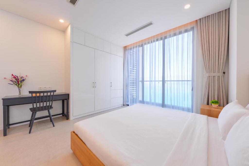 Giường trong phòng chung tại S Lux Apartment Scenia Bay Nha Trang