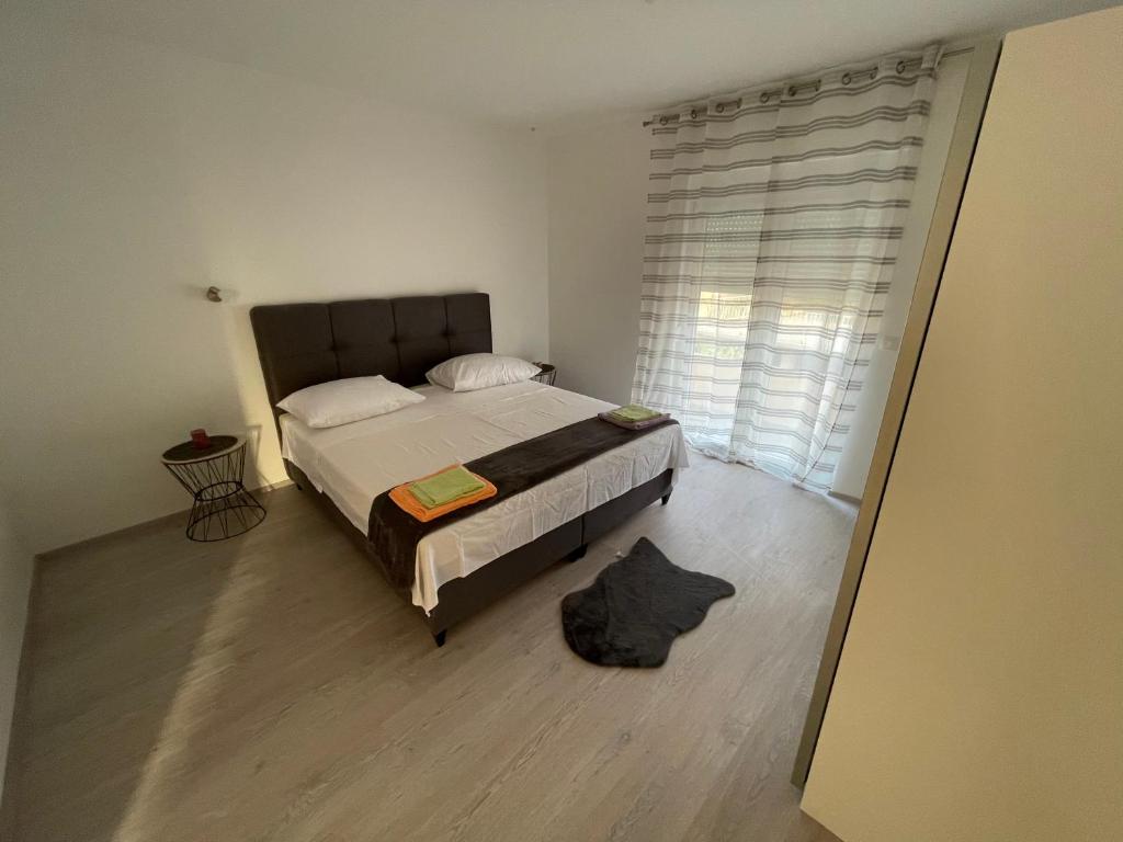 Postel nebo postele na pokoji v ubytování Ivo&Lenda2
