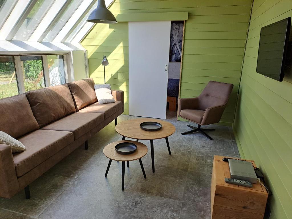 a living room with a couch and a table at Casa Ysermonde- Barkas 8 in Nieuwpoort