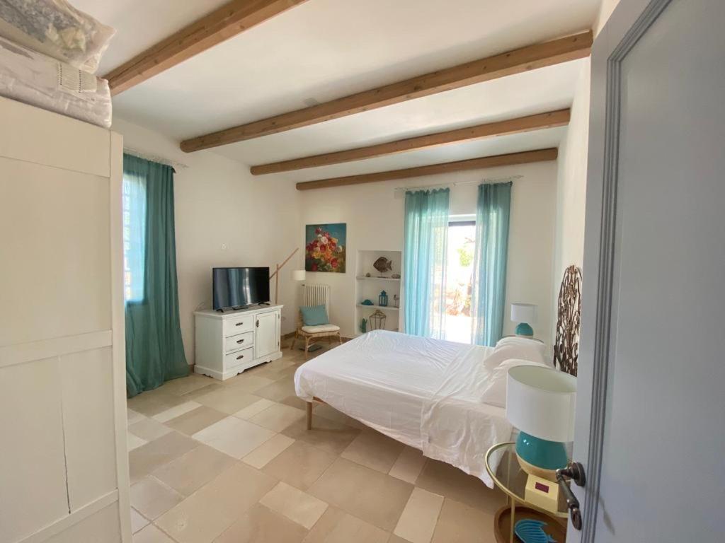En eller flere senge i et værelse på CA' DEL FICO D'INDIA - Antico Casale di charme