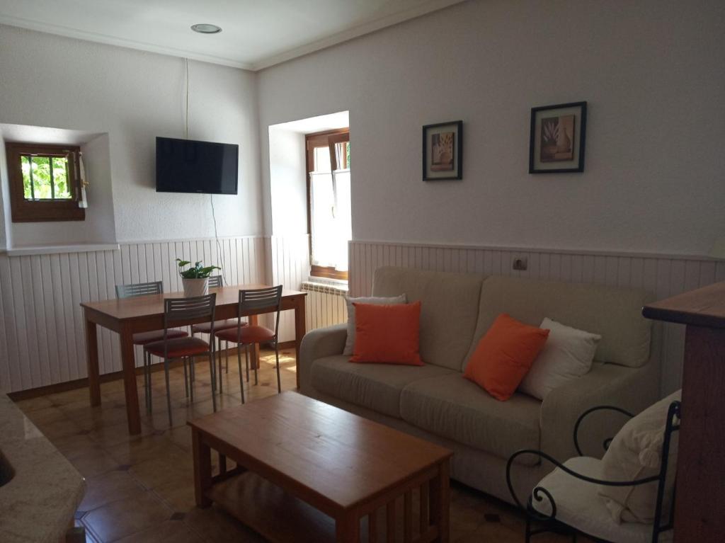 a living room with a couch and a table at TXARRENEA in Elizondo