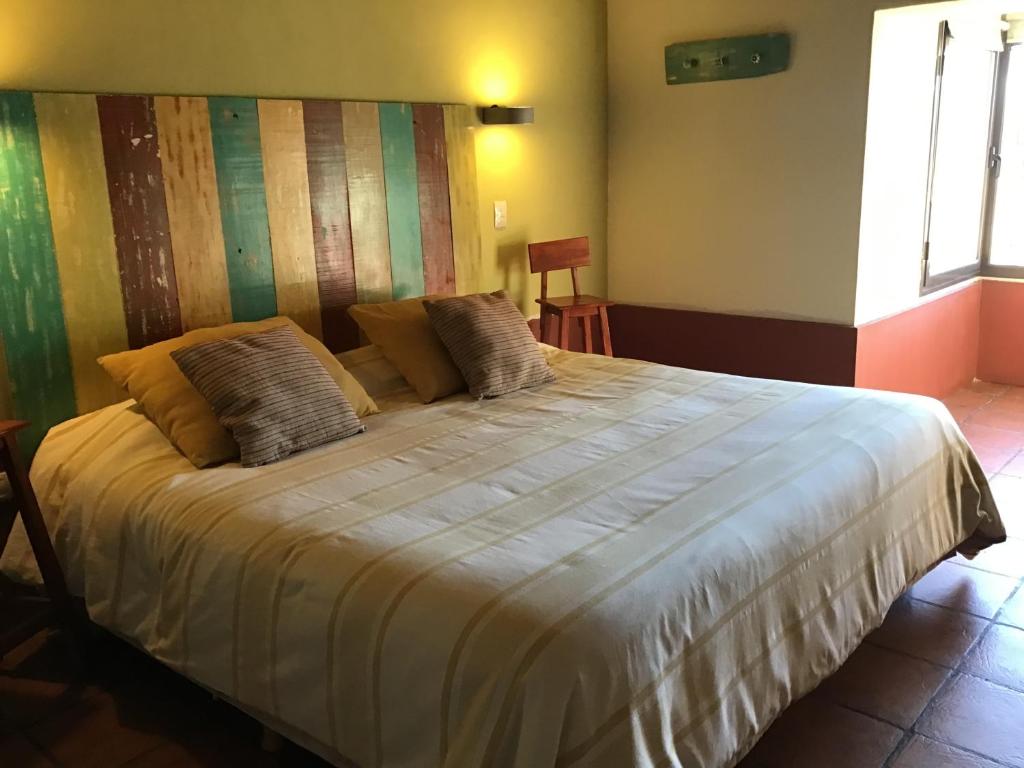Postel nebo postele na pokoji v ubytování Avalenn, Casa de Campo