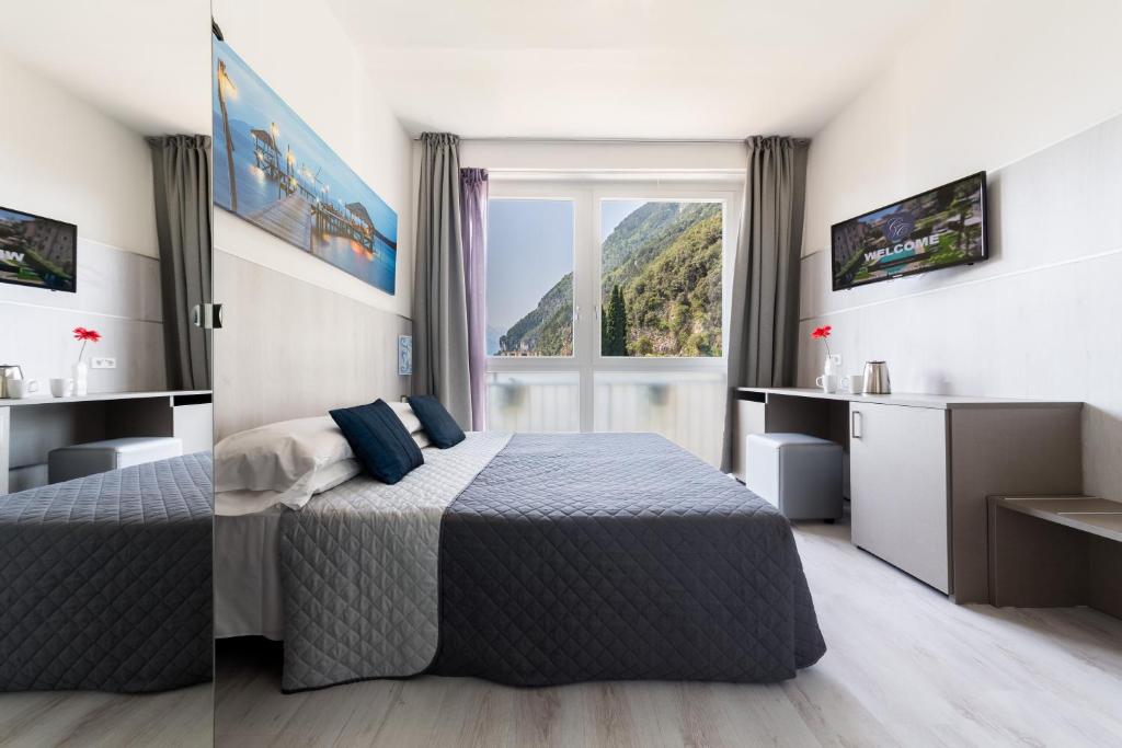 Postel nebo postele na pokoji v ubytování Hotel Canarino