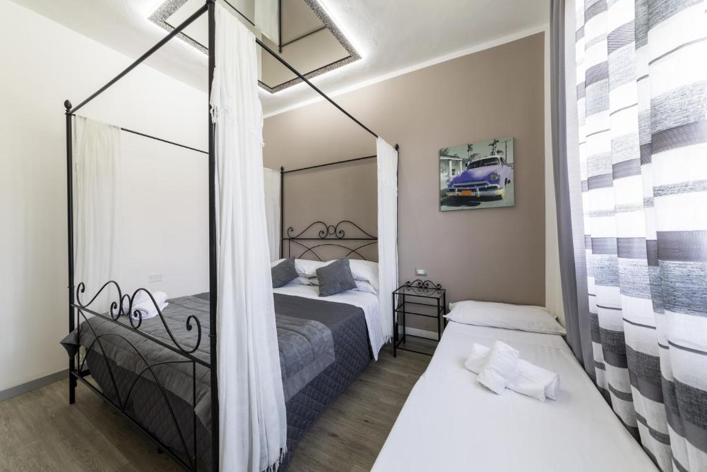 Postel nebo postele na pokoji v ubytování Hotel Canarino