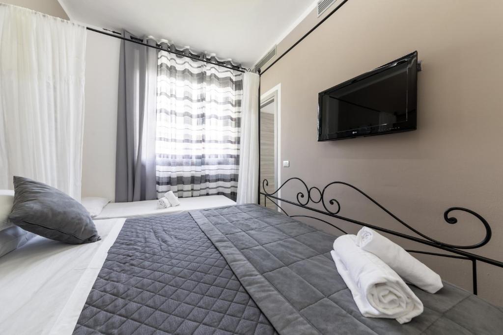 Postel nebo postele na pokoji v ubytování Hotel Canarino