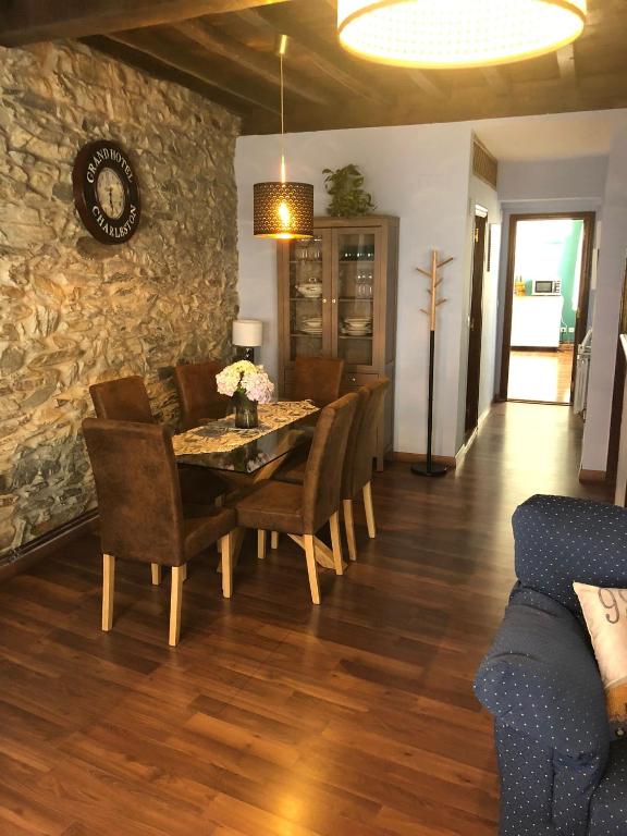 a dining room with a table and chairs at CASA LUPITA in Cudillero