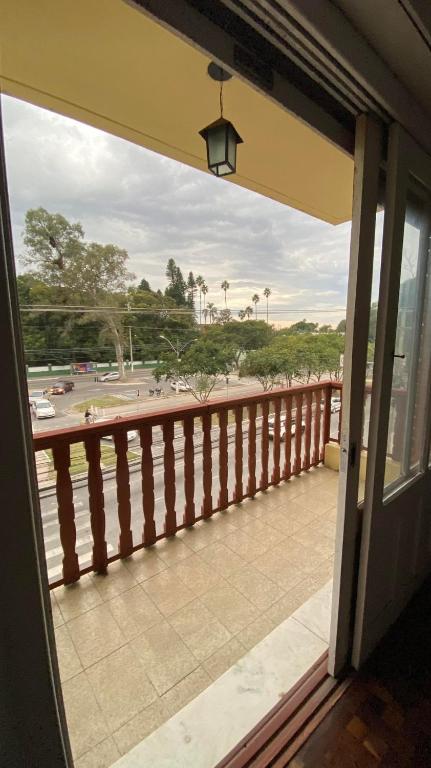 a balcony with a view of a parking lot at Apartamento com dois quartos no fragata in Pelotas
