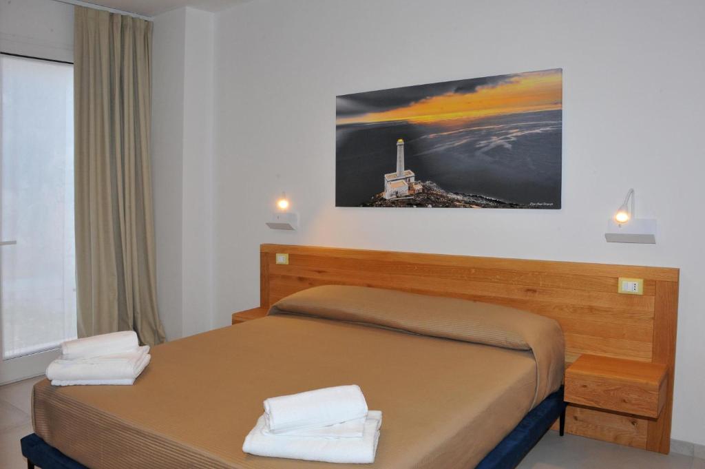 Postel nebo postele na pokoji v ubytování BluOtranto