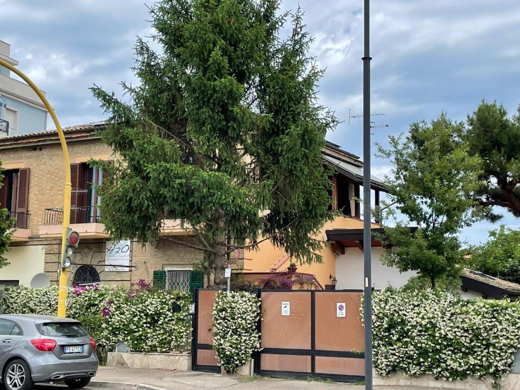 a house with a car parked in front of it at Casa Drema - Villa al mare con terrazza in Pescara