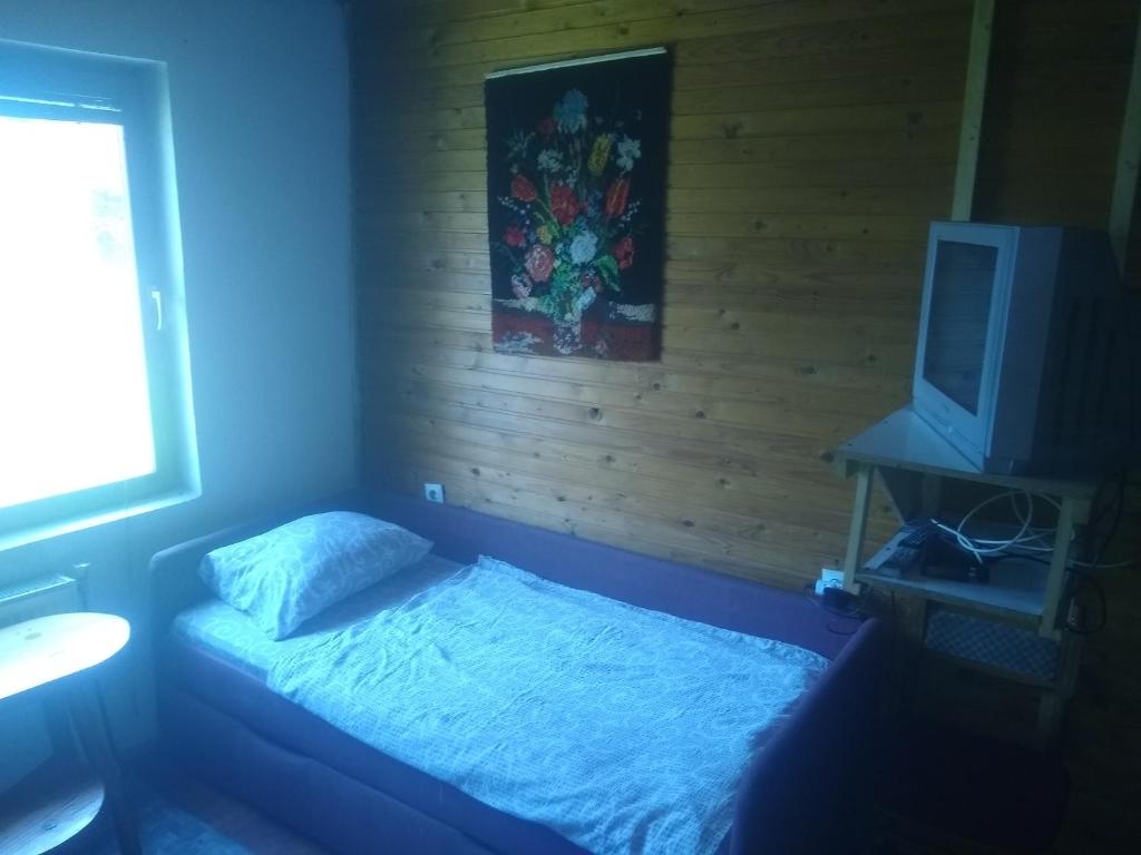 Una cama o camas en una habitación de Apartmani Gnezdo