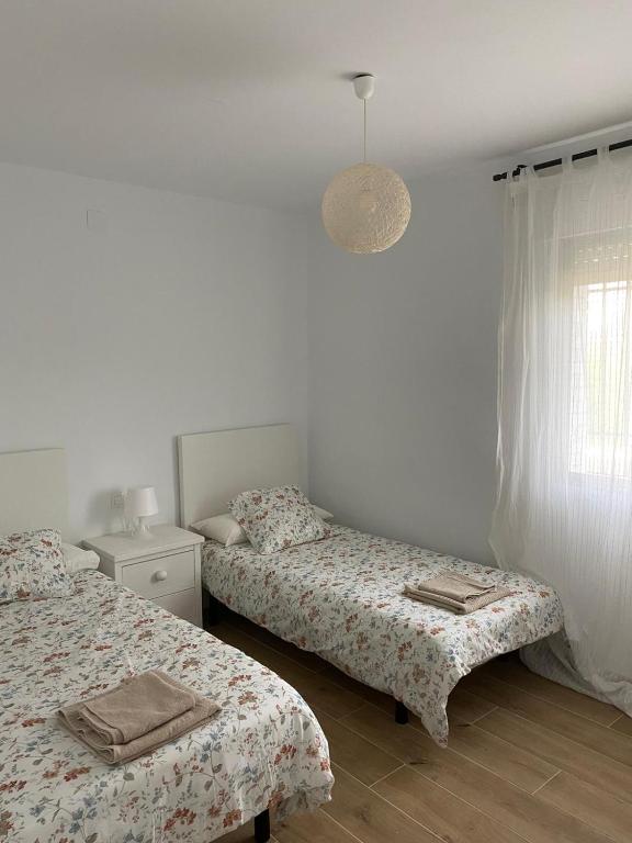 Postel nebo postele na pokoji v ubytování Villa Marta