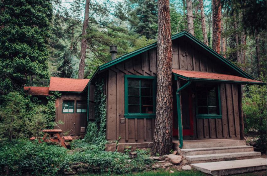 a small cabin in the middle of a forest at The Don Hoel Resort & Venue in Sedona
