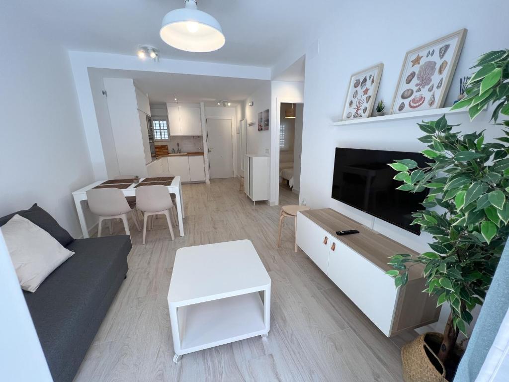 Televízia a/alebo spoločenská miestnosť v ubytovaní Tarifa Cozy House - Central - Parking - Wifi