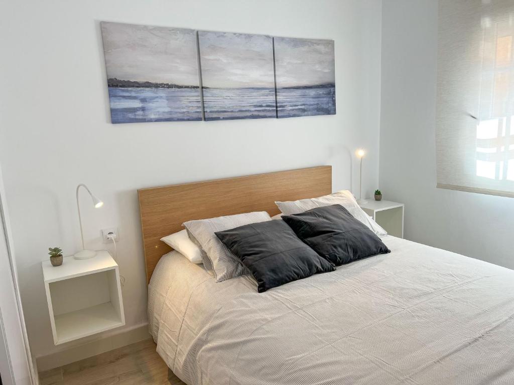 Posteľ alebo postele v izbe v ubytovaní Tarifa Cozy House - Central - Parking - Wifi