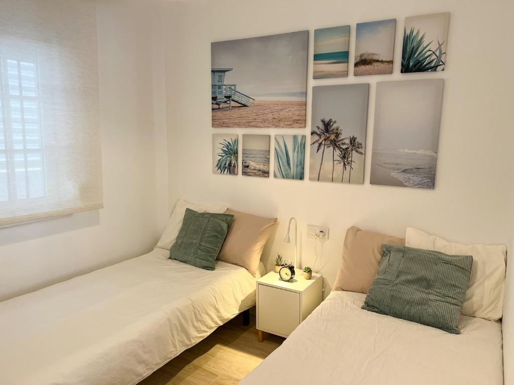 Posteľ alebo postele v izbe v ubytovaní Tarifa Cozy House - Central - Parking - Wifi