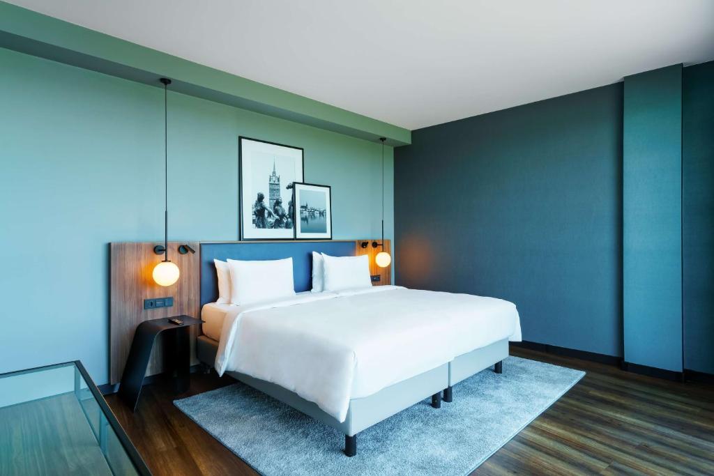 Postel nebo postele na pokoji v ubytování Radisson Blu Hotel Rostock