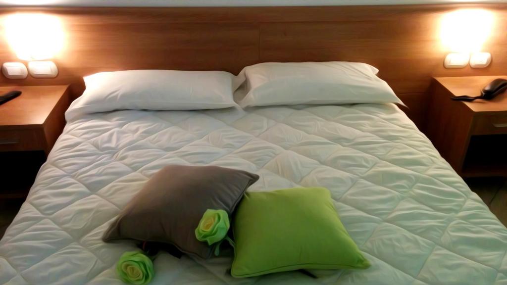 Postel nebo postele na pokoji v ubytování Hotel Venere