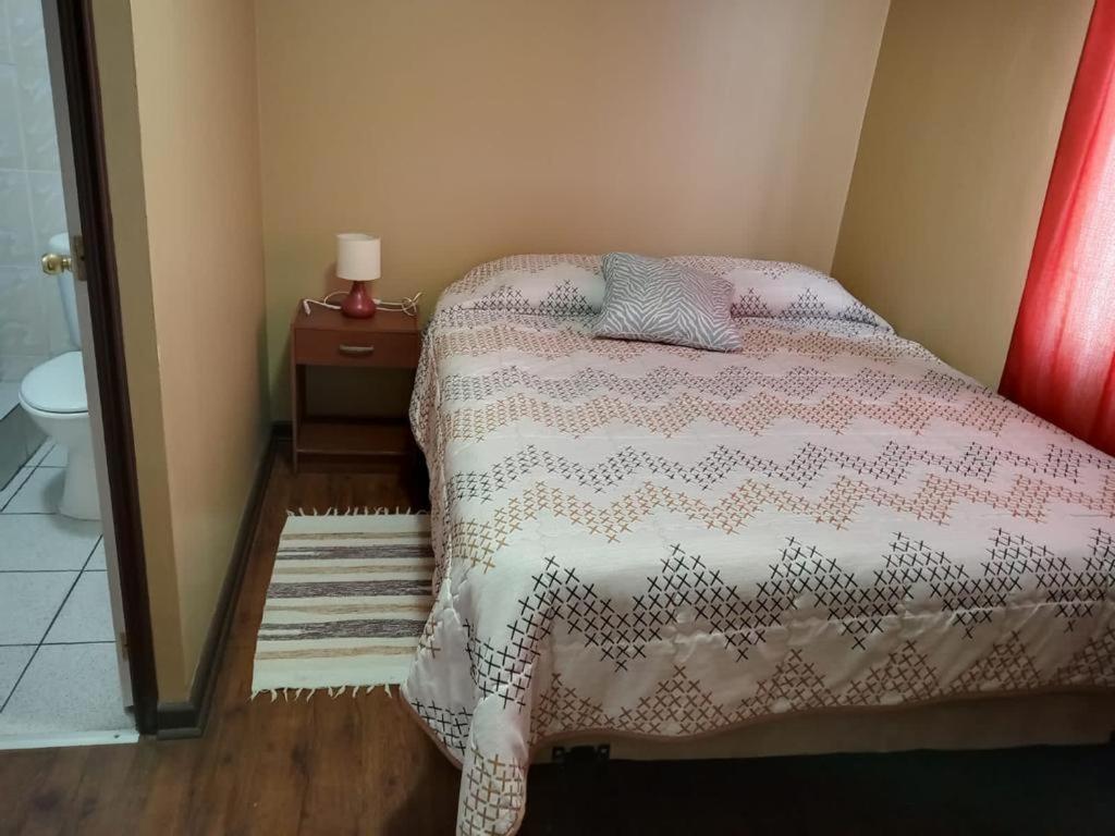 Postel nebo postele na pokoji v ubytování Hostal El Salitre
