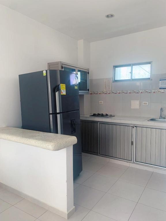 Kuchyň nebo kuchyňský kout v ubytování Blue Apartahotel