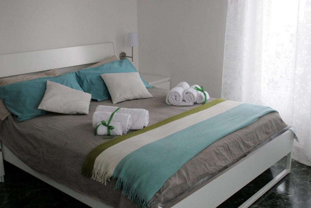 a bedroom with a bed with towels on it at A Casa di Tilde in Polignano a Mare